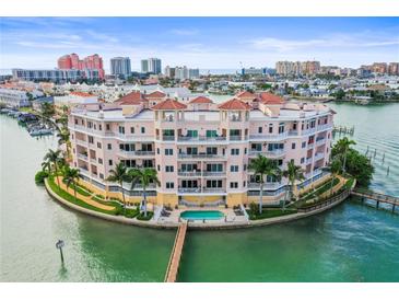 Stunning waterfront condo with a private pool and balconies, offering luxurious coastal living at 205 Brightwater Dr # 101, Clearwater Beach, FL 33767