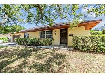 Charming single-story home featuring a well-manicured lawn and lush green shrubbery enhancing its curb appeal at 309 Kenmore Rd, Brandon, FL 33511