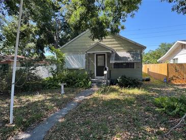 Charming single Gathering home with a quaint front yard and mature landscaping at 5431 Dartmouth N Ave, St Petersburg, FL 33710