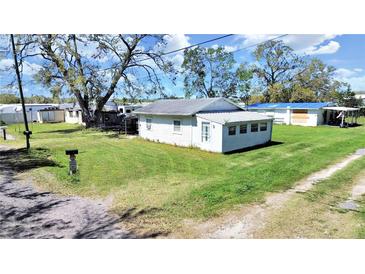Charming exterior view of a cozy single-story house featuring a well-maintained lawn and a classic mailbox at 6673 146Th N Ave, Clearwater, FL 33764
