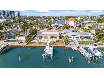 Stunning waterfront home with private dock and beautiful views of the bay, perfect for boaters at 5 Marina Ter, Treasure Island, FL 33706