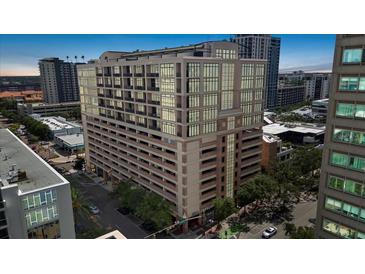 Modern building featuring large windows, architectural details, and a covered parking garage in a vibrant urban setting at 175 S 2Nd S St # Ph-16, St Petersburg, FL 33701