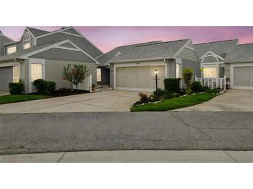 Charming townhome featuring a well-manicured lawn and a two-car garage at 3520 51St W Ave, Bradenton, FL 34210
