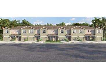 Attractive exterior view of townhomes with well-maintained landscaping and individual one-car garages at 3629 Copper Beech Dr, Land O Lakes, FL 34638