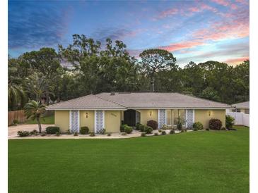 Charming single-story home boasts a well-manicured lawn and decorative exterior lighting at 3900 38Th S St, St Petersburg, FL 33711