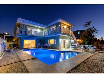 Inviting waterfront home featuring a private pool and multiple decks, perfect for enjoying outdoor living at 474 20Th Ave, Indian Rocks Beach, FL 33785