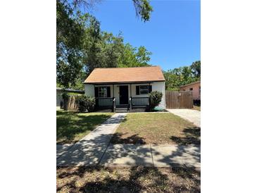 Charming single-story home with a cozy front porch and well-maintained lawn at 1675 13Th S Ave, St Petersburg, FL 33712