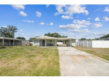Charming single-story home with a carport and spacious front yard at 2830 Anthony St, Tampa, FL 33619
