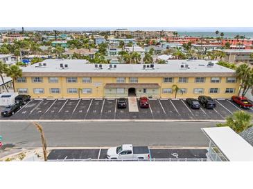 A well-maintained three-story condo building with ample parking in a coastal setting at 600 71St Ave # 18, St Pete Beach, FL 33706