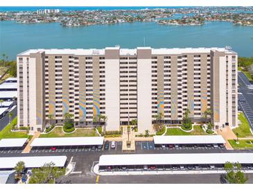 Large condo complex with multiple floors, parking, and views of the bay at 7050 Sunset S Dr # 1401, South Pasadena, FL 33707