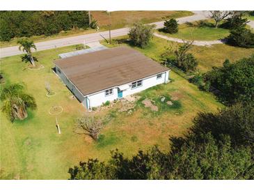 Aerial view of a single-story home with a spacious lawn at 3614 Vasco St, Punta Gorda, FL 33950