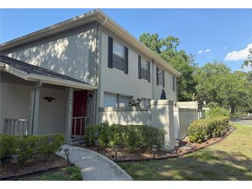 Well-maintained two-story home with manicured landscaping and a welcoming walkway at 11764 Raintree Dr # 0, Temple Terrace, FL 33617