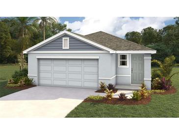 Charming single-story home with a two-car garage, landscaped yard, and a welcoming front entrance at 1010 Spotted Egret Loop, Ruskin, FL 33570