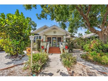 Charming home with a welcoming front porch and lush landscaping at 2450 2Nd N Ave, St Petersburg, FL 33713