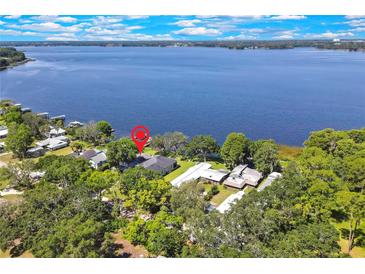 Stunning lakefront property with lush greenery and scenic water views at 550 George S St, Tarpon Springs, FL 34688