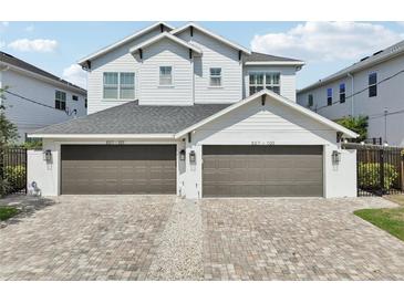 Beautiful exterior of home featuring a brick driveway and attached two-car garages at 307 S Arrawana Ave # 100, Tampa, FL 33609