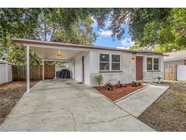 Charming single-story home with a carport, stone accents, and a well-manicured front yard at 2646 61St N Ave, St Petersburg, FL 33714