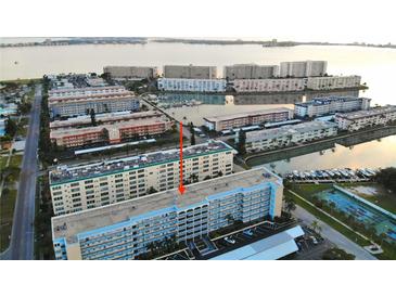 A beautiful aerial view of the condo and surrounding community that includes marina and ocean views at 2850 59Th S St # 310, Gulfport, FL 33707