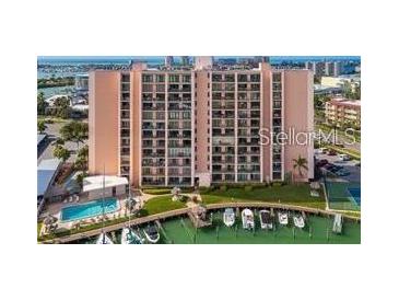 Condo building with pool and boat docks offers waterfront living and easy access to the bay at 51 Island Way # 309, Clearwater Beach, FL 33767