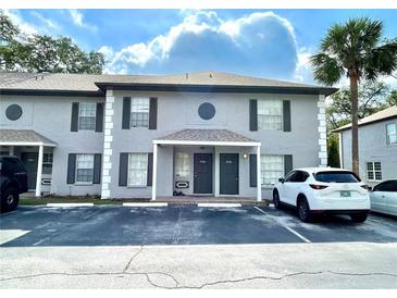 Well-maintained condo building with covered entries, and convenient parking in a serene neighborhood at 5110 Sunridge Palms Dr, Tampa, FL 33617