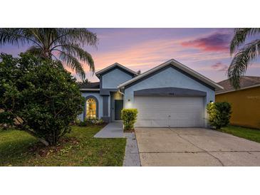 Charming single Gathering home with a two-car garage and well-maintained landscaping at 12510 Sparkleberry Rd, Tampa, FL 33626