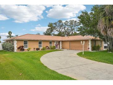 Charming single-story home with a well-manicured lawn and a long, winding driveway at 14564 110Th Ter, Largo, FL 33774