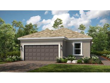 New construction shows a one-story home with a two-car garage, minimal landscaping, and neutral colors at 4286 Cairoli Ct, Wesley Chapel, FL 33543