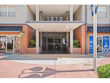 Building entrance featuring modern architectural design, brick accents, and prominent numerical signage at 1010 Central Ave # 227, St Petersburg, FL 33705