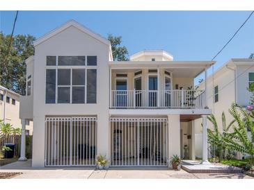 Charming two-story home with a spacious covered balcony and gated parking at 3412 W San Juan St # B, Tampa, FL 33629
