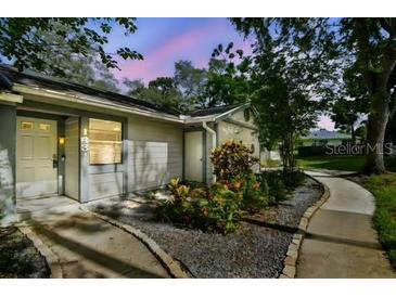 Charming single-story home with cozy front yard landscaping and inviting entrance at 39650 Us Highway 19 N # 143, Tarpon Springs, FL 34689