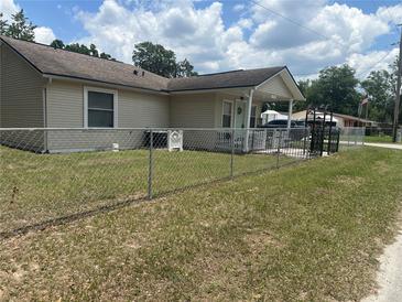 Cozy single story home with fenced yard and welcoming front porch at 11814 Washington St, Seffner, FL 33584