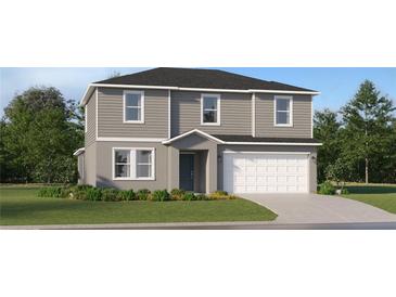 Charming two-story home with gray siding, white trim, a two-car garage, and a well-maintained lawn at 11909 Brae Way, Dade City, FL 33525