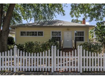 Charming single-story home featuring a welcoming entrance and a classic white picket fence at 2710 10Th N St, St Petersburg, FL 33702