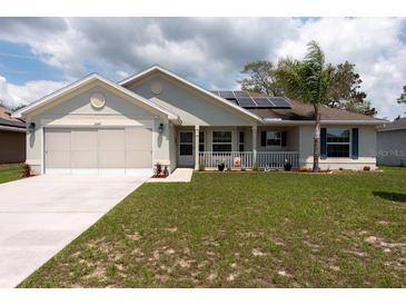 Charming single-story home with well-maintained lawn, two car garage and solar panels at 3642 Fantasy Way, Brooksville, FL 34604