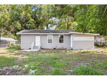 Charming single-story home with a well-maintained lawn and cozy front porch at 4804 N 18Th St, Tampa, FL 33610