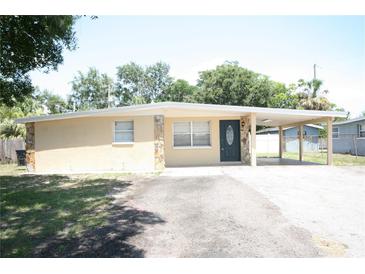 Charming single-story home featuring a covered carport and neutral-colored exterior at 5417 Golden Dr, Tampa, FL 33634