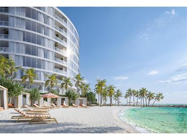 Luxury beachfront property featuring a modern condo building, sandy beach, and picturesque palm trees at 805 S Gulfview Blvd # 402B, Clearwater, FL 33767