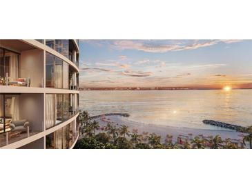 Waterfront condominium building featuring private balconies with beach and ocean views at sunset at 805 S Gulfview Blvd # 602A, Clearwater, FL 33767