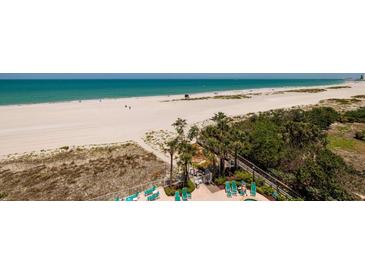 Breathtaking beach view from condo complex featuring white sand and clear ocean waters at 1310 Gulf Blvd # 6C, Clearwater Beach, FL 33767