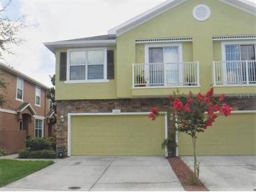 Inviting two-story home with a two-car garage and charming balconies at 5107 5Th N Way, St Petersburg, FL 33703