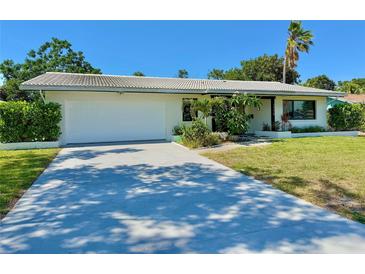 Charming one-story home with a two-car garage, mature landscaping, and a beautiful, tiled roof at 1775 62Nd S Ter, St Petersburg, FL 33712