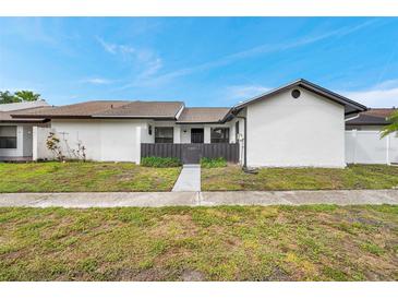 Charming single-story home featuring a well-maintained lawn and a private front entrance at 5306 Marlwood Ct, Tampa, FL 33624