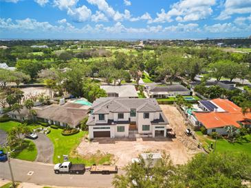 Stunning new two-story home with lush landscaping in a desirable neighborhood near a golf course and the ocean at 944 31St Ne Ter, St Petersburg, FL 33704