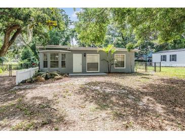 Charming single-story home featuring a well-kept yard and fenced perimeter at 7347 Pulsar St, New Port Richey, FL 34652
