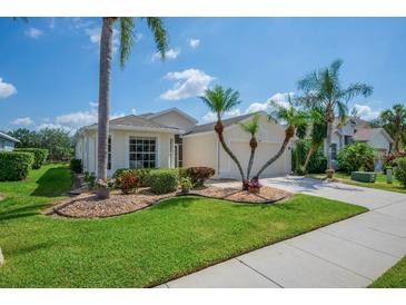 Charming single-story home with well-maintained landscaping and a neatly manicured green lawn at 8223 Haven Harbour Way, Bradenton, FL 34212