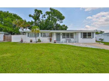 Charming single-story home featuring a manicured lawn, freshly painted exterior, and delightful curb appeal at 513 Fairhope Dr, Apollo Beach, FL 33572