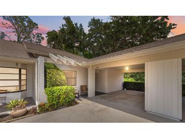 Charming home exterior featuring a covered carport and well-maintained landscaping at 9307 Golf View Dr, New Port Richey, FL 34655