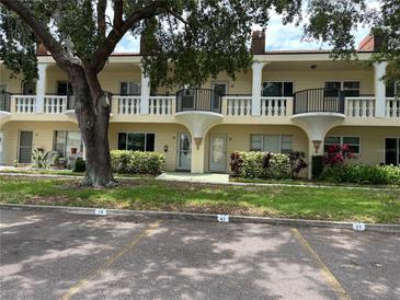 Charming condominium featuring classic architecture, private balconies, and landscaped grounds at 2295 Mexican Way # 41, Clearwater, FL 33763