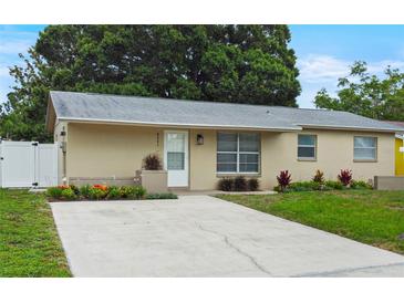 Charming single-story home with landscaped front yard and long driveway at 8451 81St Way, Seminole, FL 33777