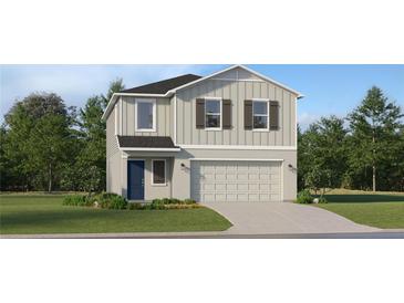 Charming two-story home with a neatly landscaped front yard and attached two car garage at 2273 Blue Grosbeak Pl, Wimauma, FL 33598